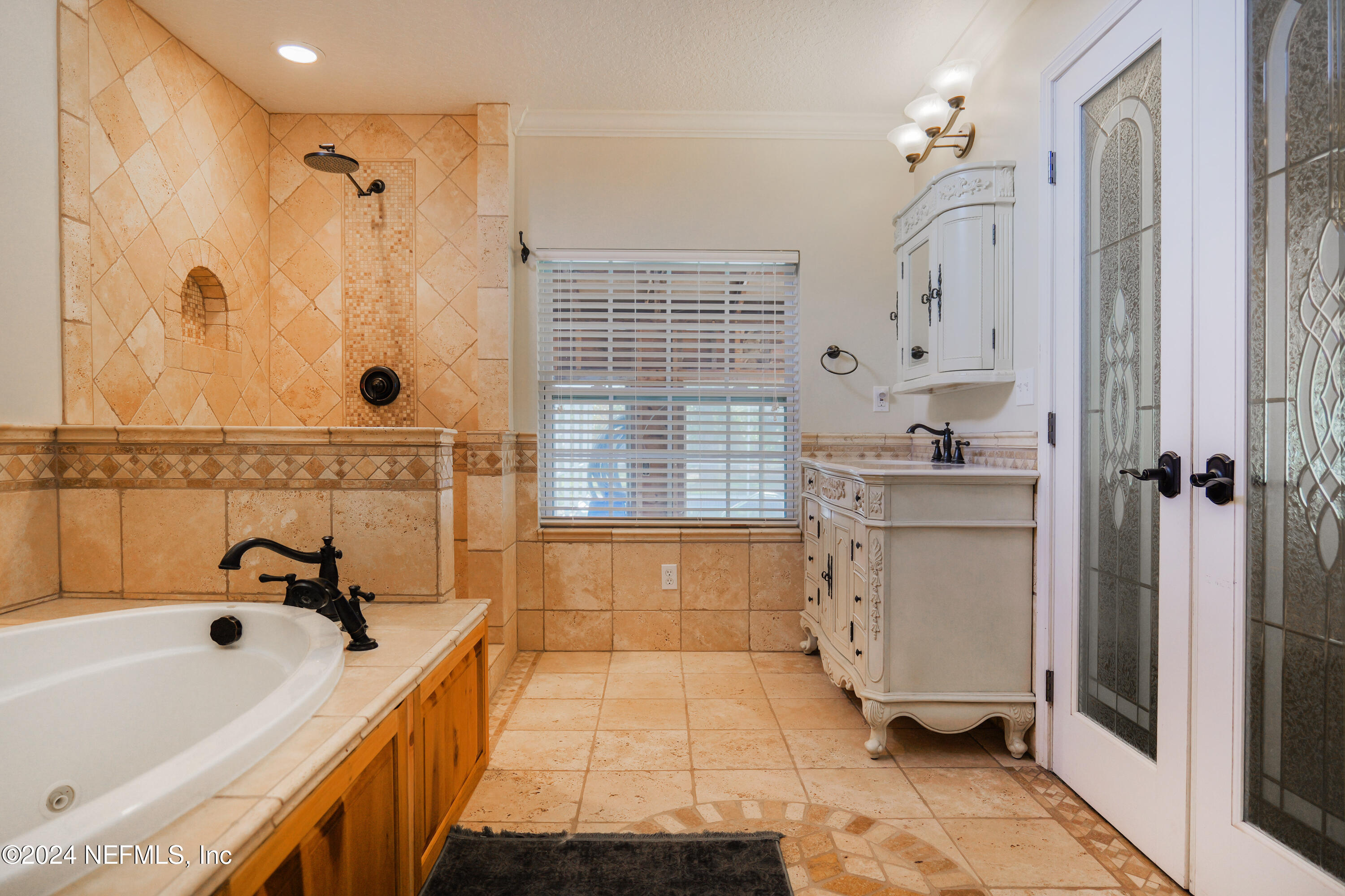6566 Sherry Lane St. Augustine, FL 32095 - Photo 13 of 24 a bathroom with a bathtub a sink and a shower