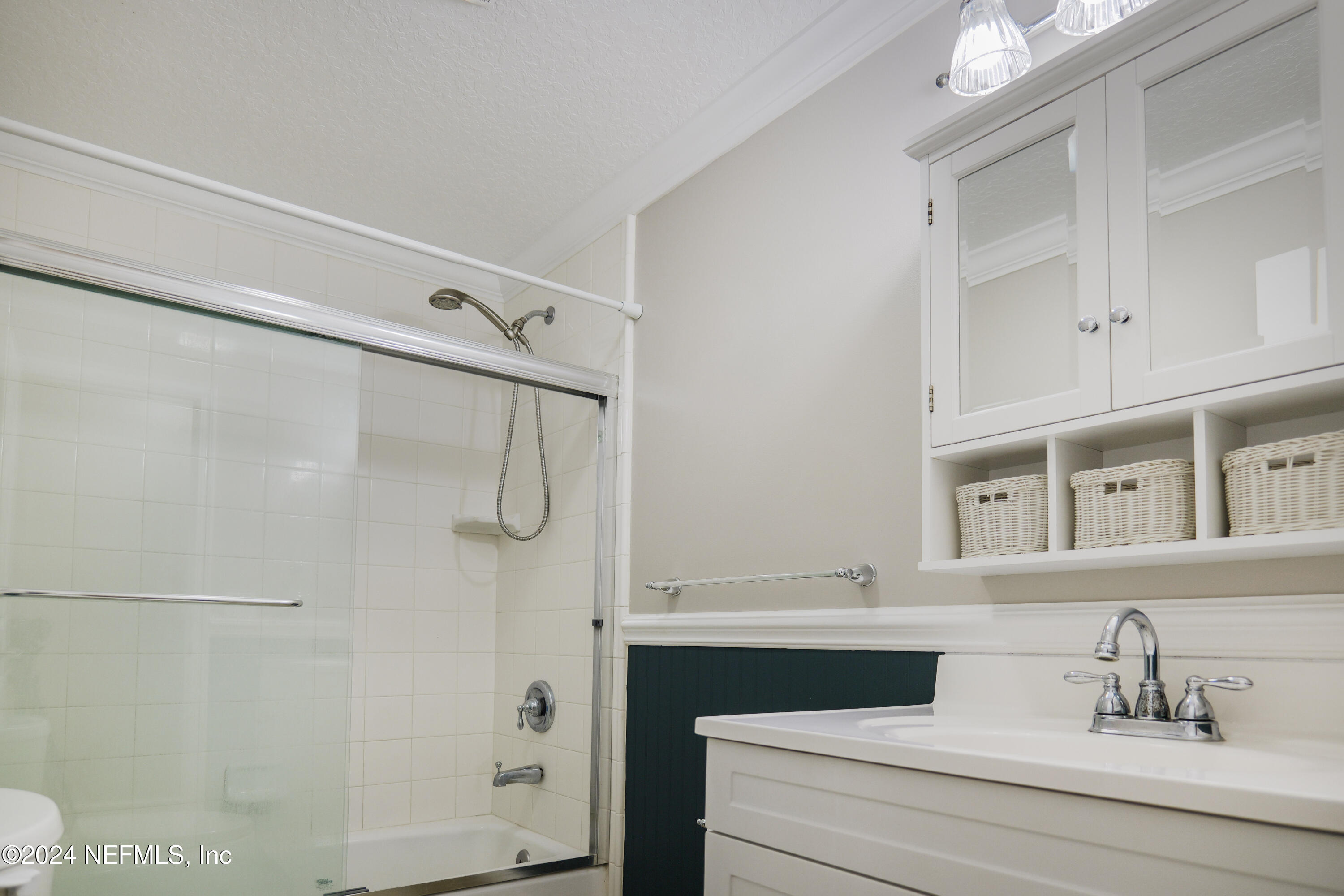 6566 Sherry Lane St. Augustine, FL 32095 - Photo 15 of 24 a bathroom with a sink vanity and shower
