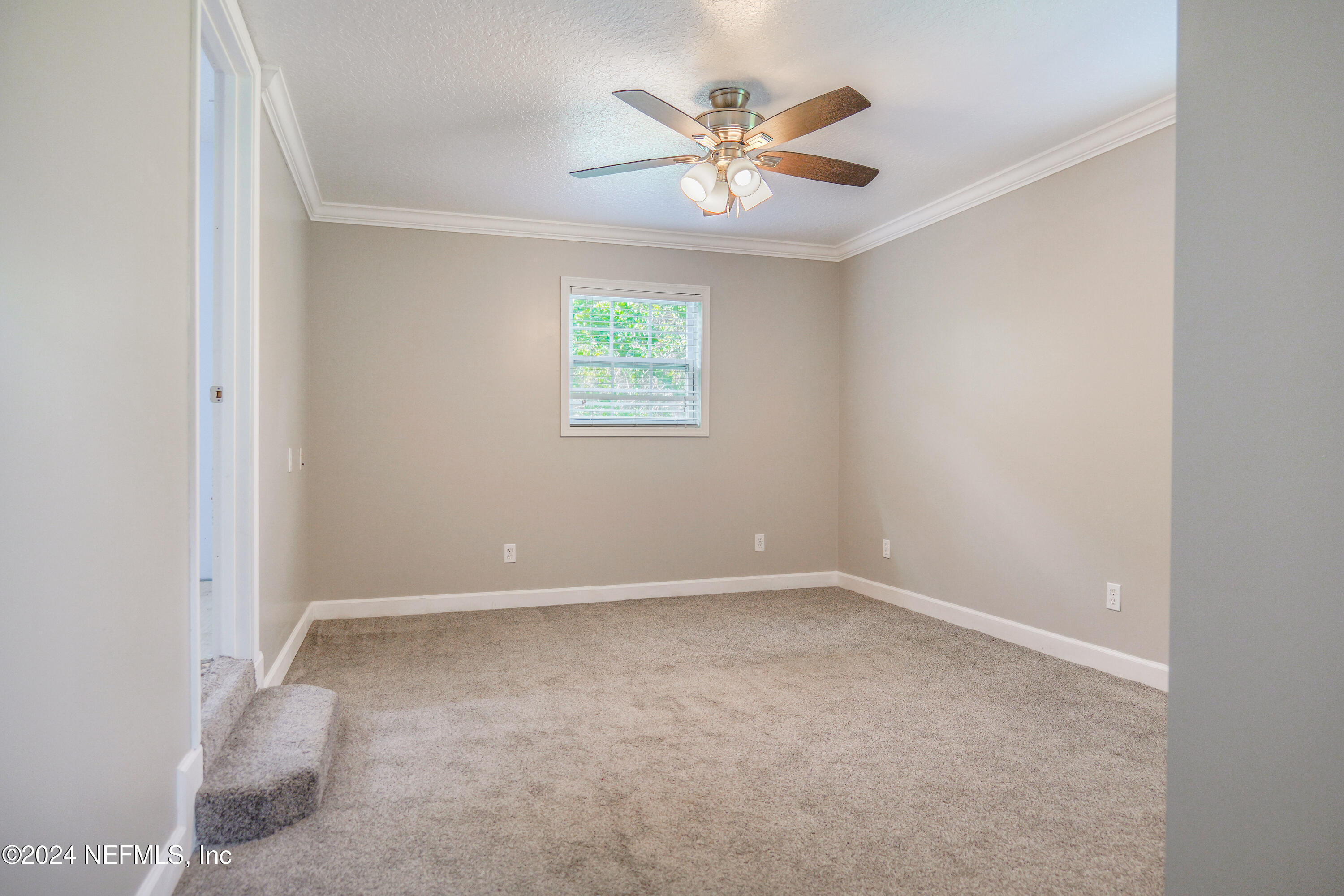6566 Sherry Lane St. Augustine, FL 32095 - Photo 16 of 24 an empty room with a window