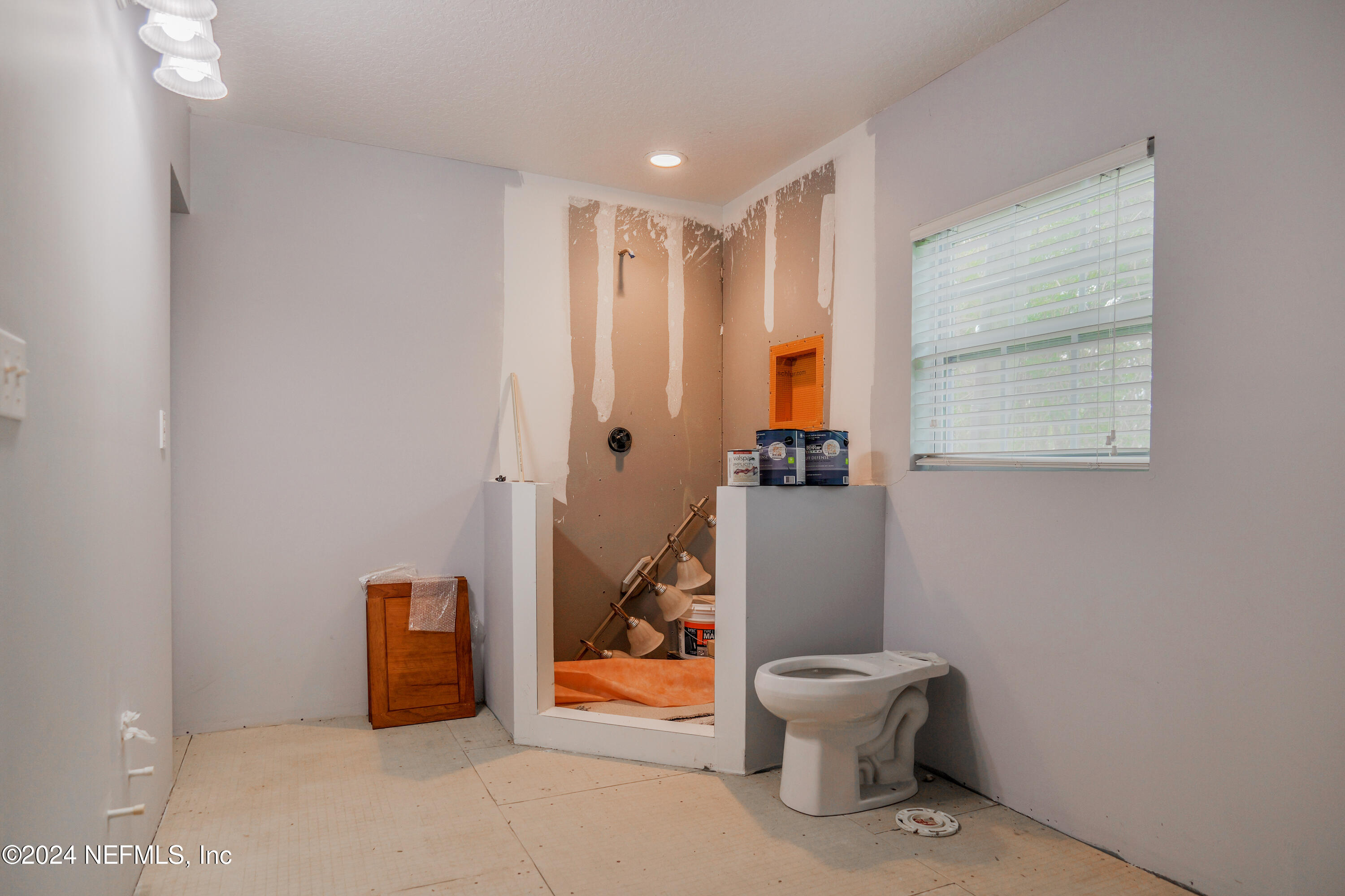 6566 Sherry Lane St. Augustine, FL 32095 - Photo 17 of 24 a bathroom with a toilet and a shower