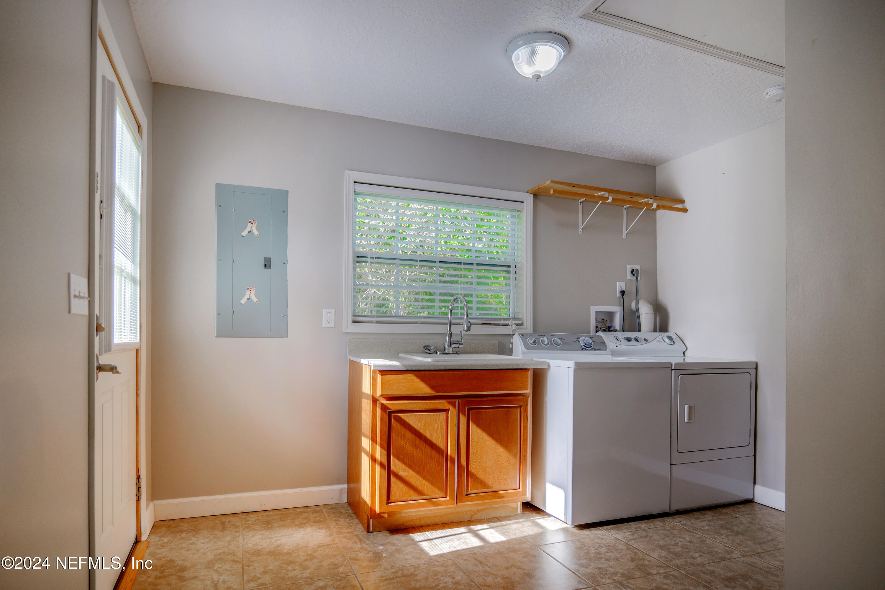 6566 Sherry Lane St. Augustine, FL 32095 - Photo 18 of 24 a kitchen with a sink and cabinets