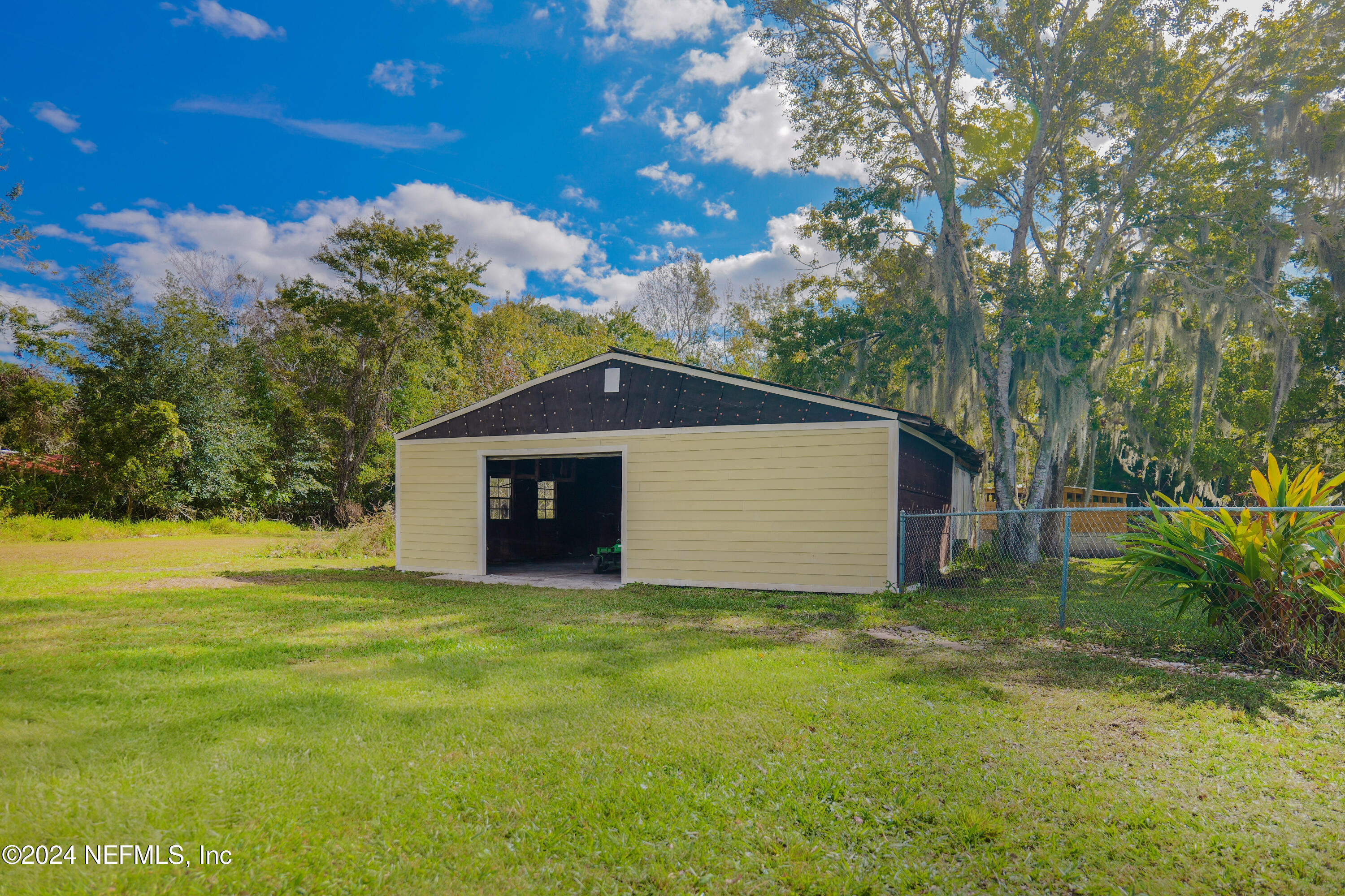 6566 Sherry Lane St. Augustine, FL 32095 - Photo 20 of 24 a front view of a house with yard and trees