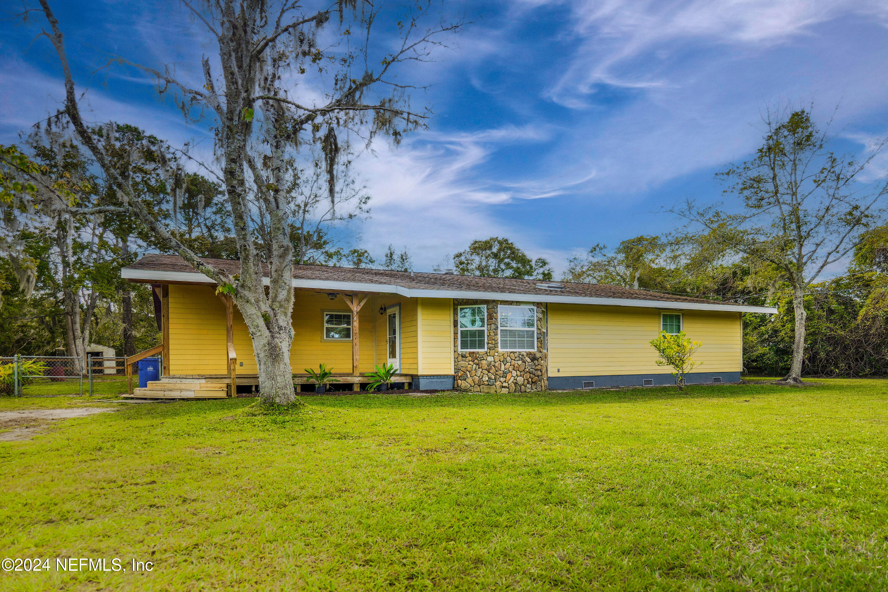 6566 Sherry Lane St. Augustine, FL 32095 - Photo 2 of 24 a front view of a house with a yard