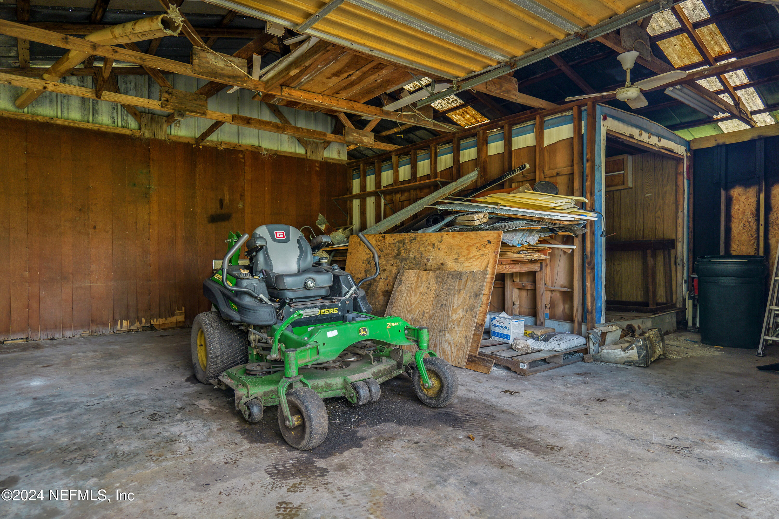 6566 Sherry Lane St. Augustine, FL 32095 - Photo 21 of 24 a view of a garage with chairs