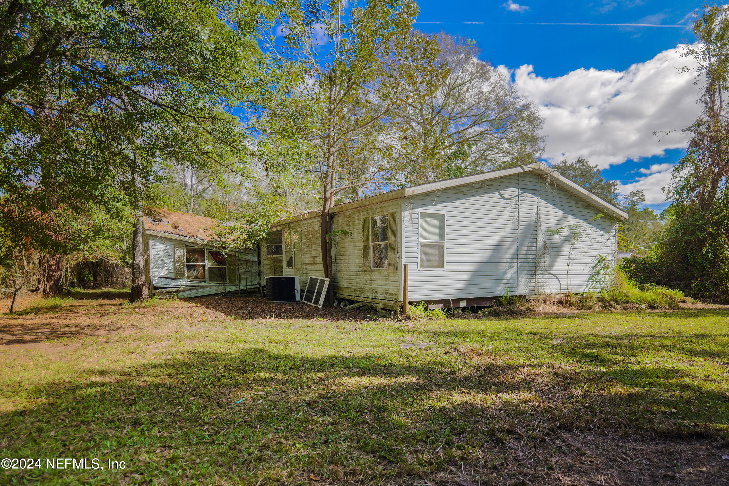 6566 Sherry Lane St. Augustine, FL 32095 - Photo 23 of 24 a backyard of a house with lots of green space