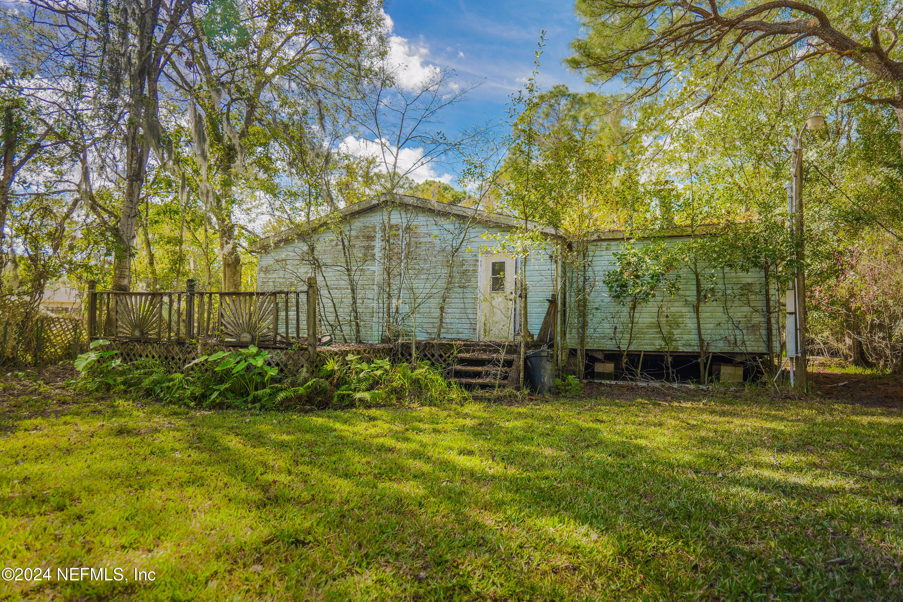 6566 Sherry Lane St. Augustine, FL 32095 - Photo 24 of 24 a view of backyard with swimming pool and green space