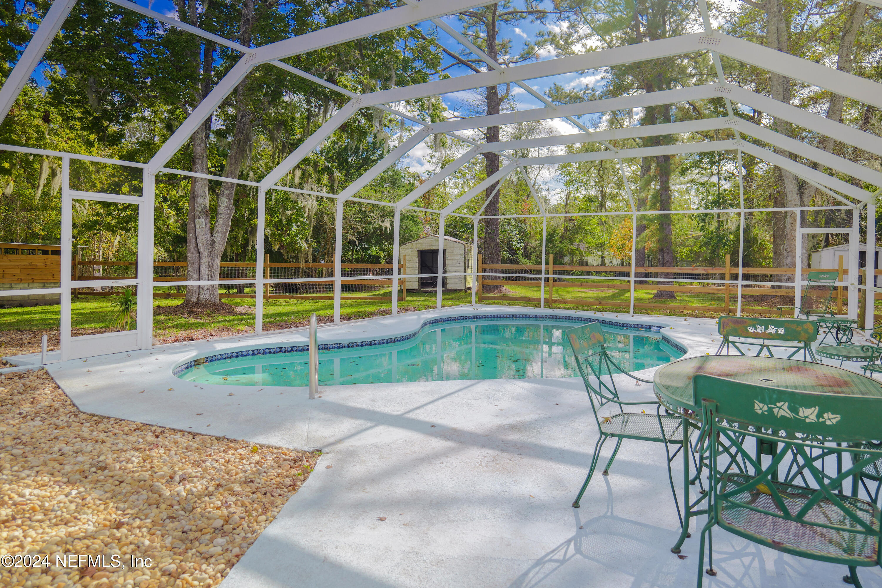 6566 Sherry Lane St. Augustine, FL 32095 - Photo 3 of 24 a view of a swimming pool with a lounge chair