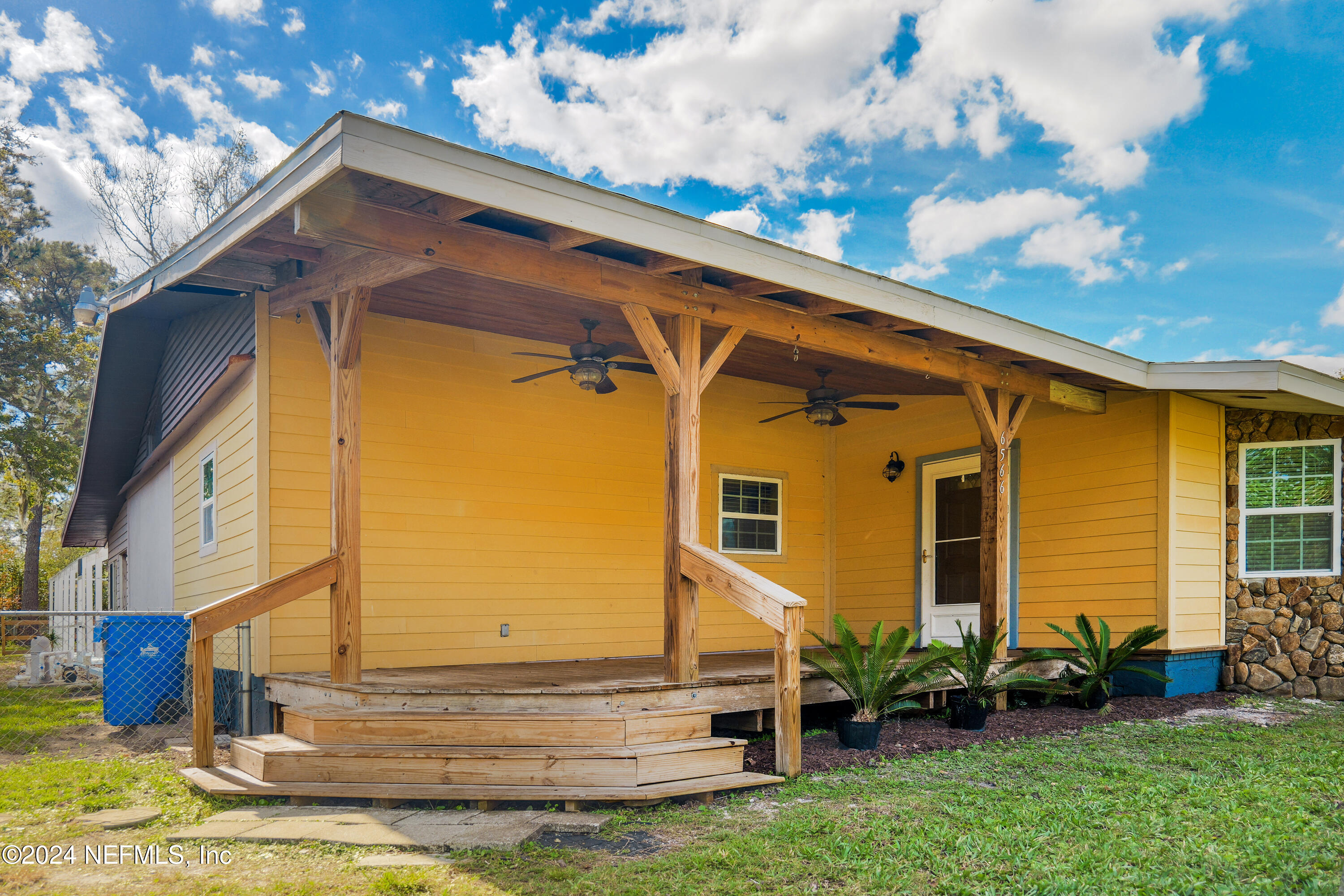6566 Sherry Lane St. Augustine, FL 32095 - Photo 4 of 24 a view of a house with a small yard