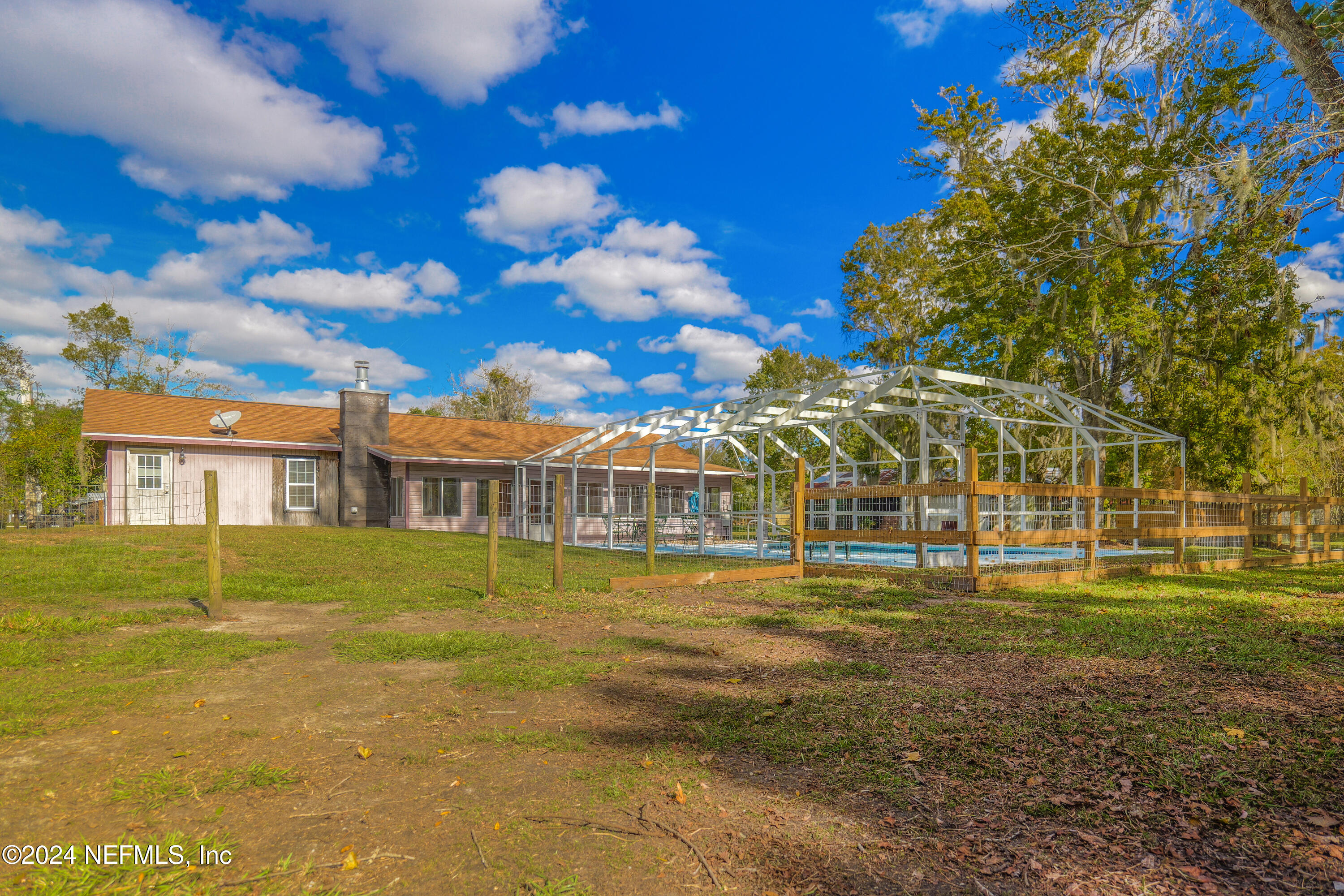 6566 Sherry Lane St. Augustine, FL 32095 - Photo 5 of 24 a front view of a house with a yard
