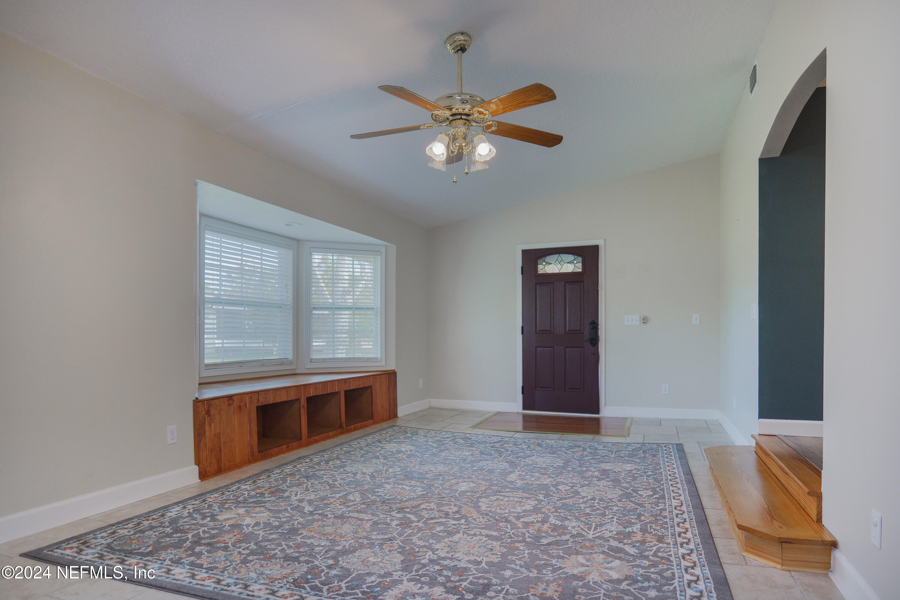 6566 Sherry Lane St. Augustine, FL 32095 - Photo 6 of 24 an empty room with fan and windows