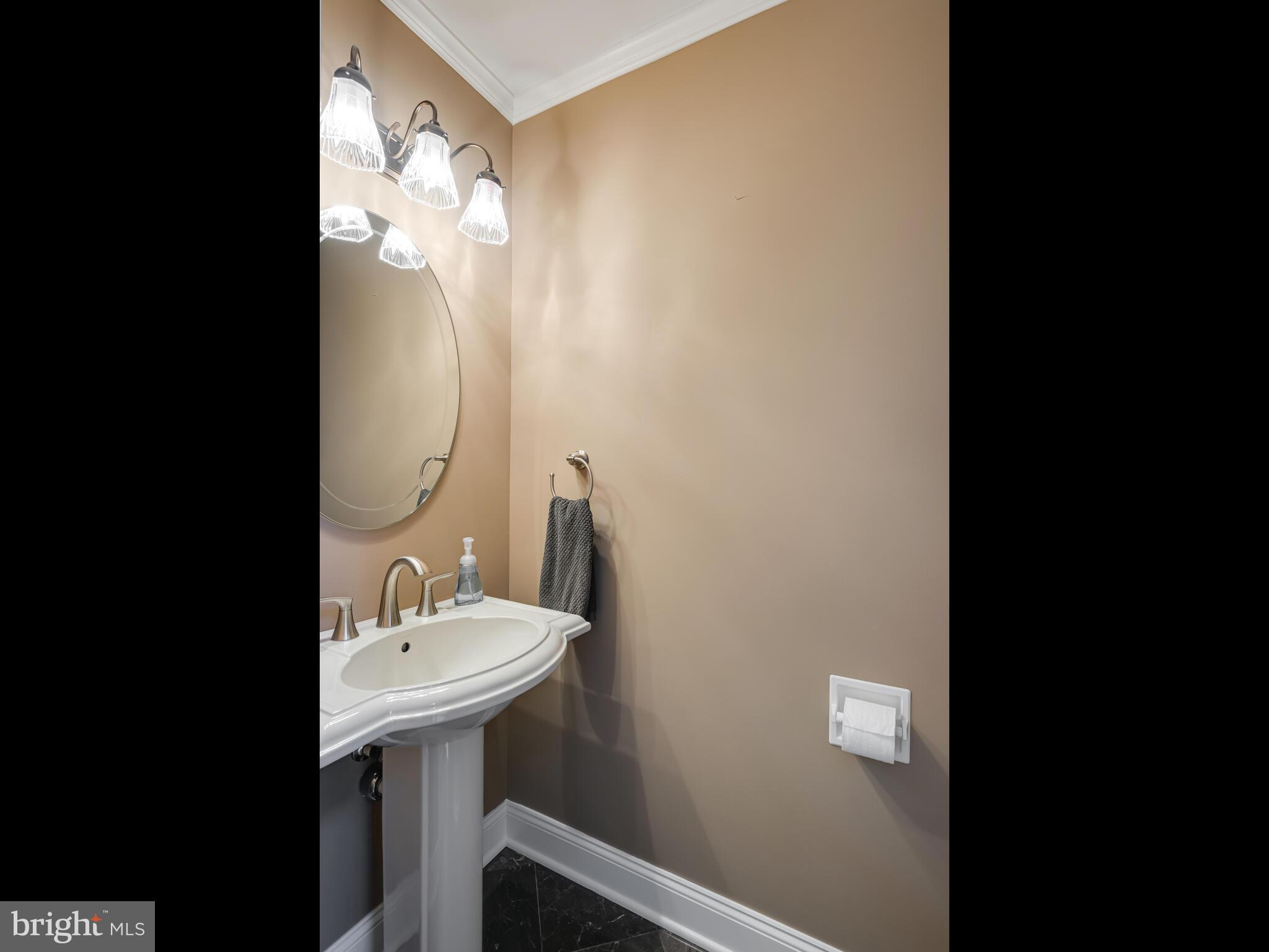 116 Cedar Knoll Road Coatesville, PA 19320 - Photo 12 of 35 Powder Rm Pedastal sink, marble floors, chair-rail