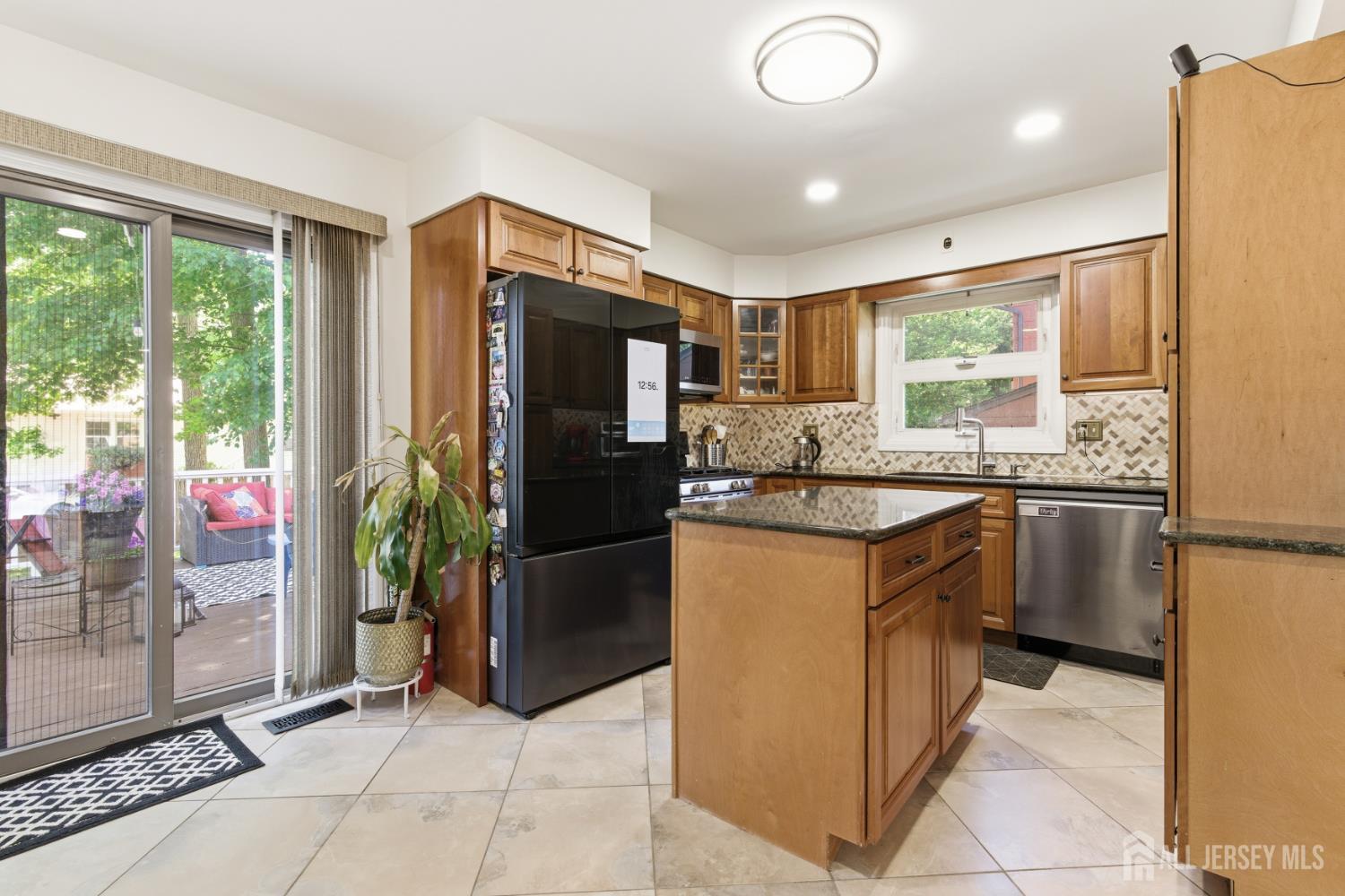 213 Normandy Road Edison, NJ 08820 - Photo 14 of 45 a kitchen with stainless steel appliances granite countertop a refrigerator and a sink