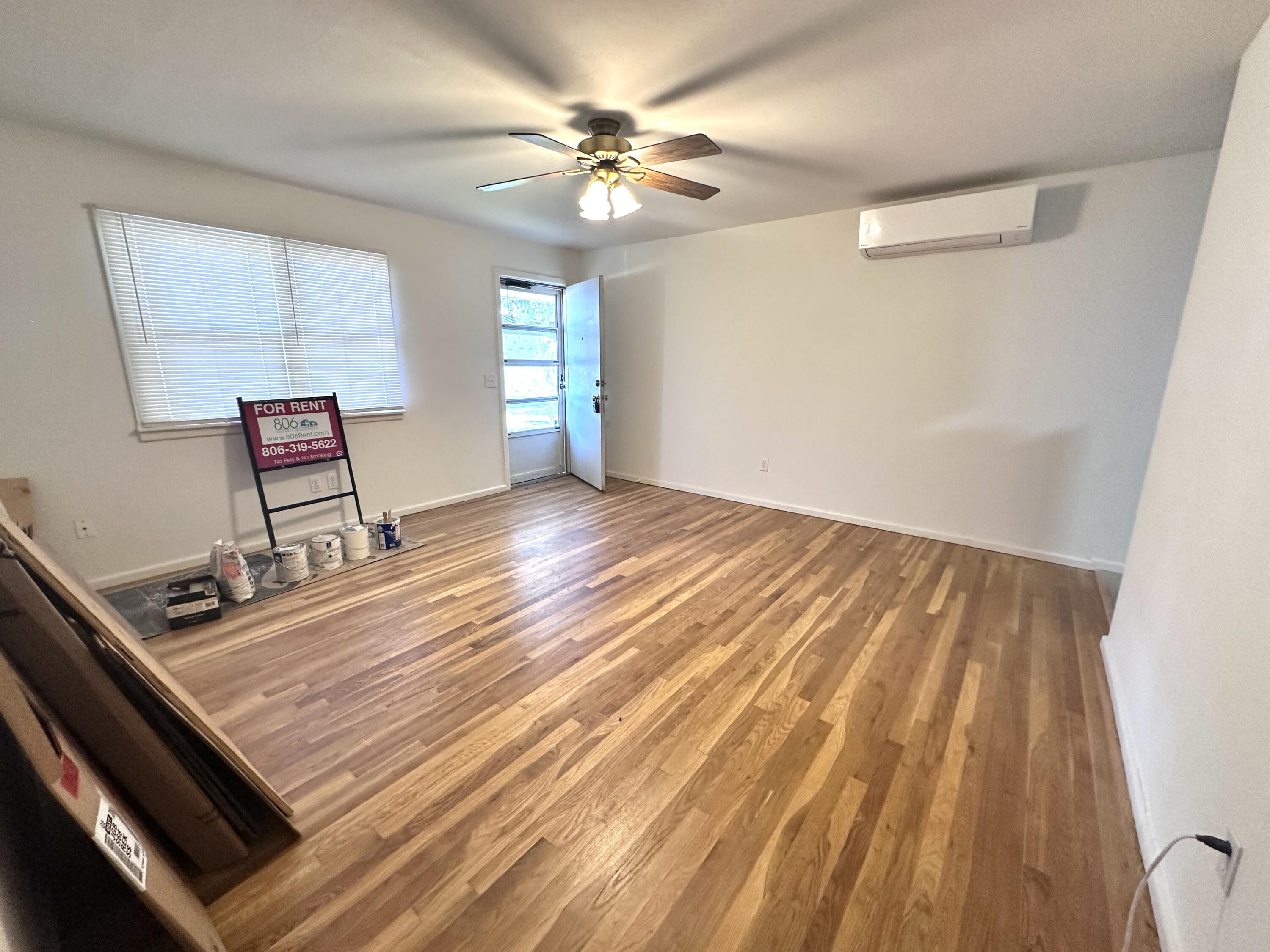 3719 30th Street, Unit A Lubbock, TX 79410 - Photo 14 of 16 wooden floor with a window