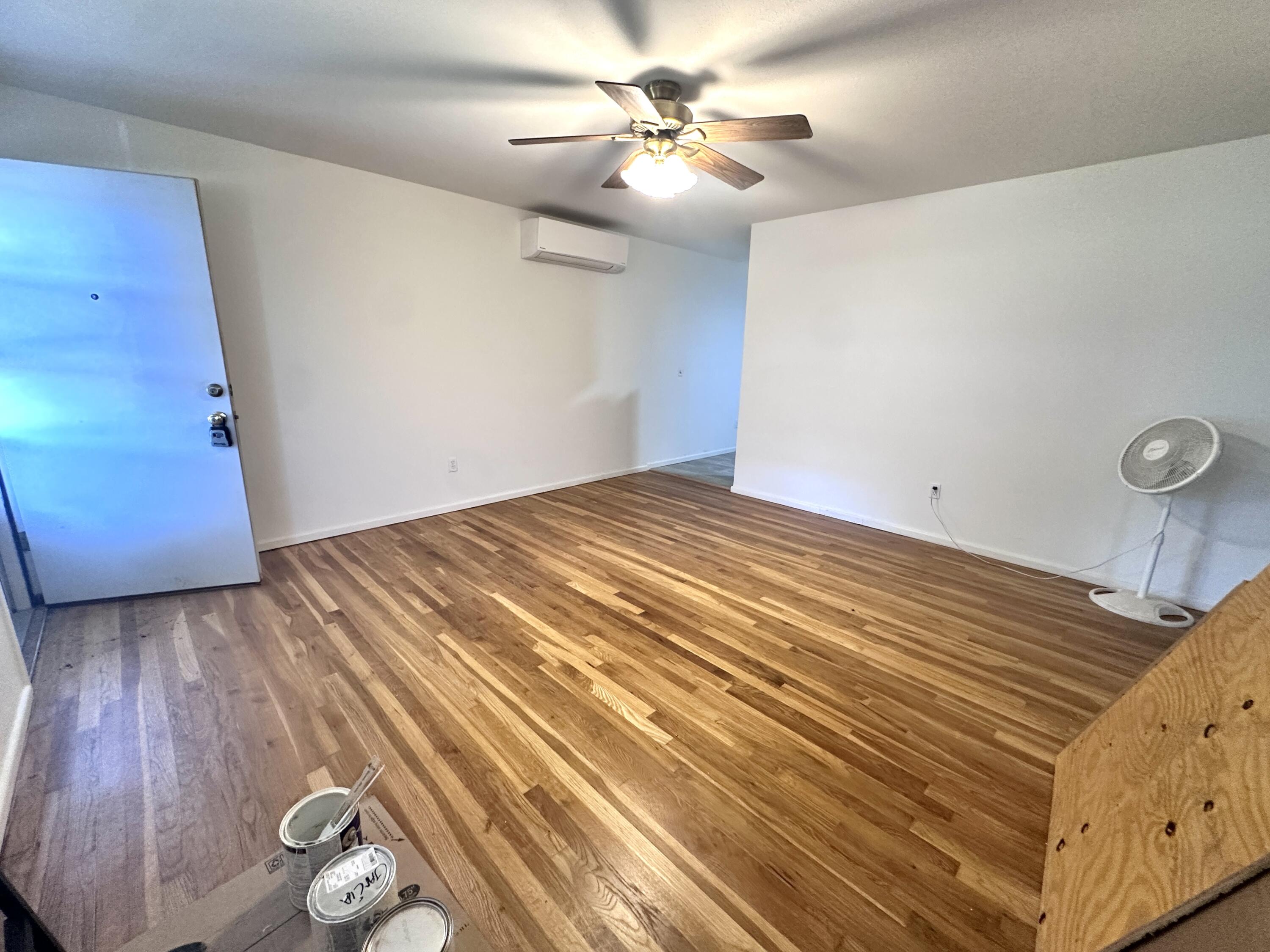 3719 30th Street, Unit A Lubbock, TX 79410 - Photo 15 of 16 a bedroom with a bed and a chandelier