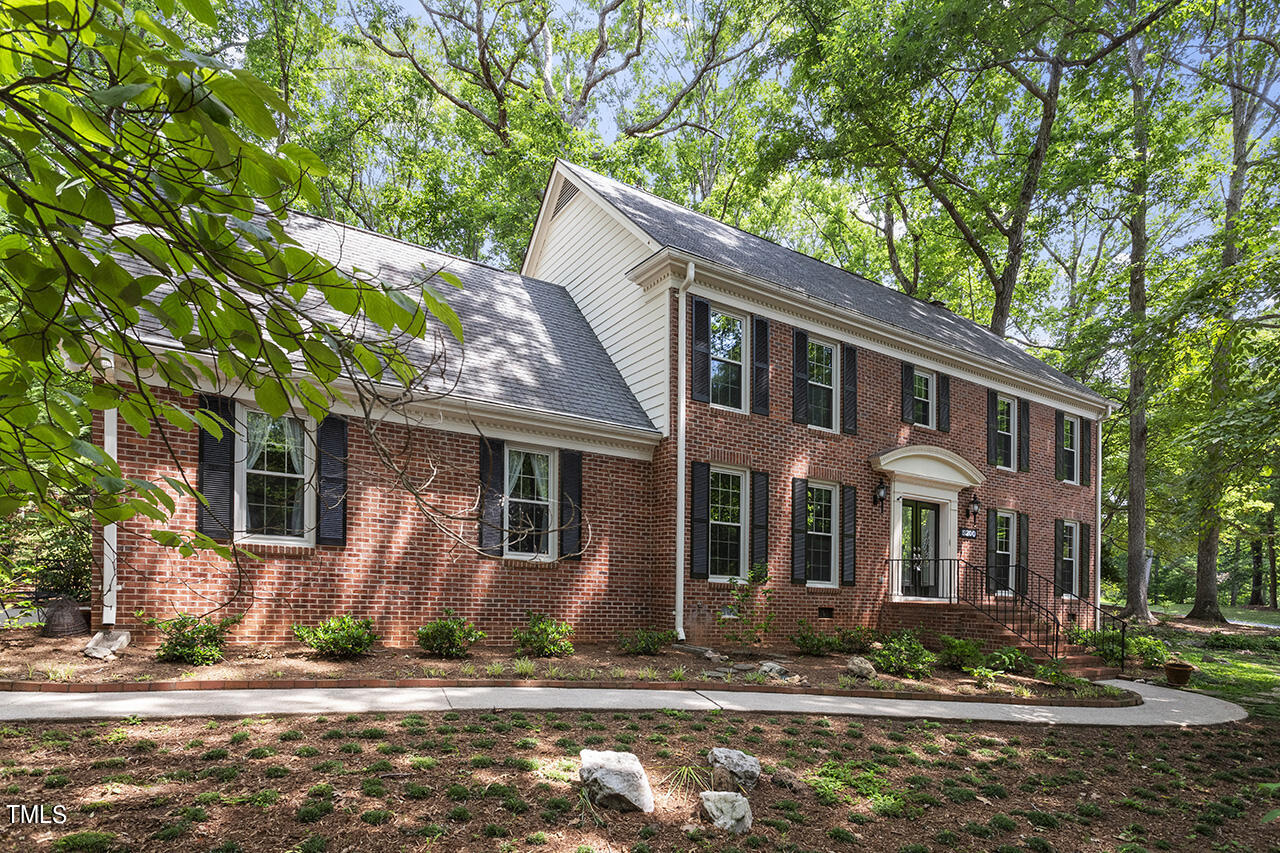 5200 Smallwood Court Raleigh, NC 27613 - Photo 1 of 38 a front view of a house with a yard
