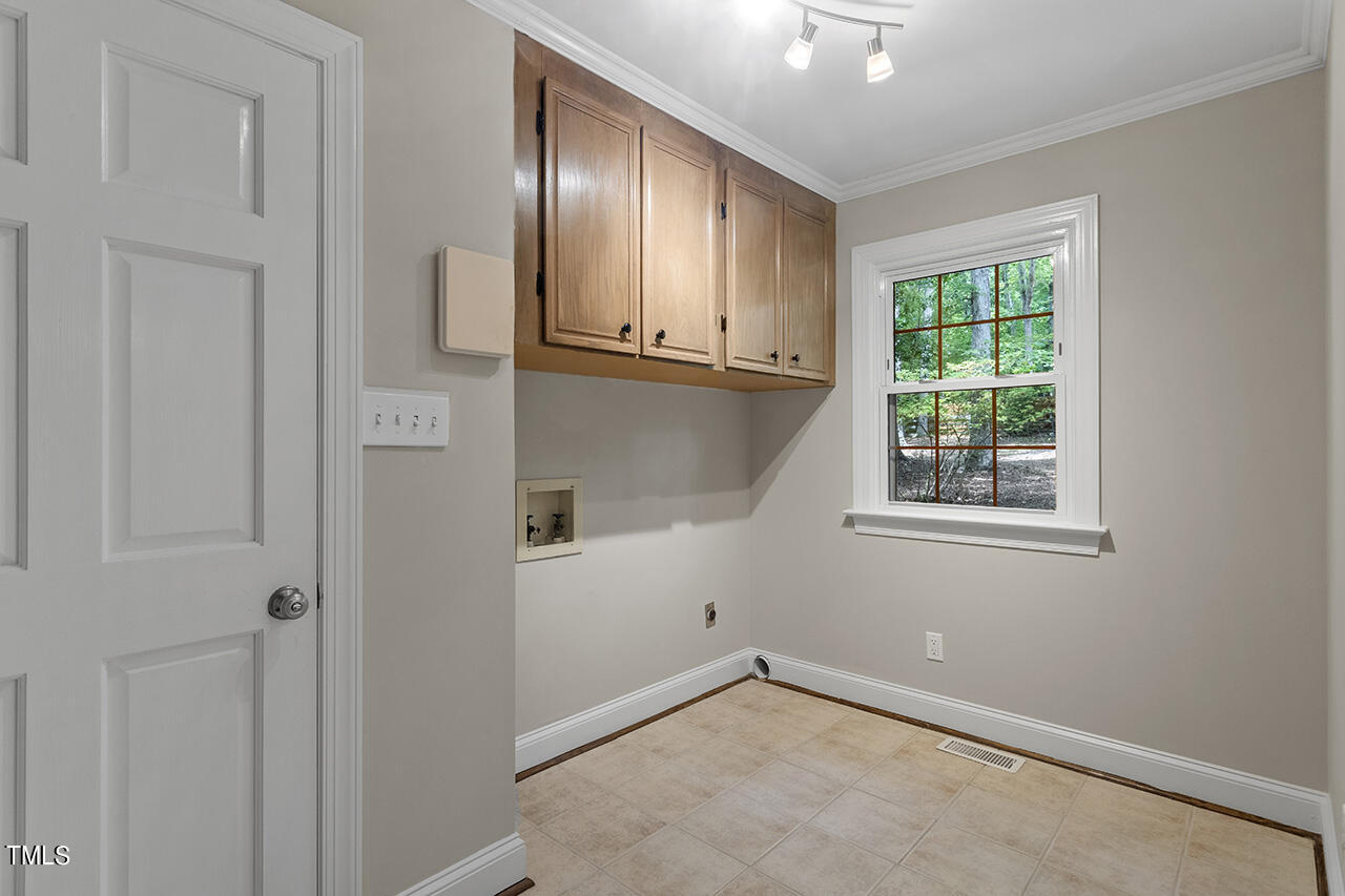 5200 Smallwood Court Raleigh, NC 27613 - Photo 15 of 38 an empty room with windows