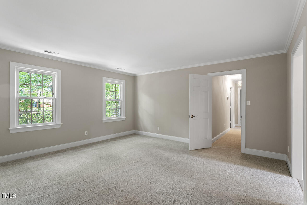 5200 Smallwood Court Raleigh, NC 27613 - Photo 16 of 38 a view of an empty room with a window