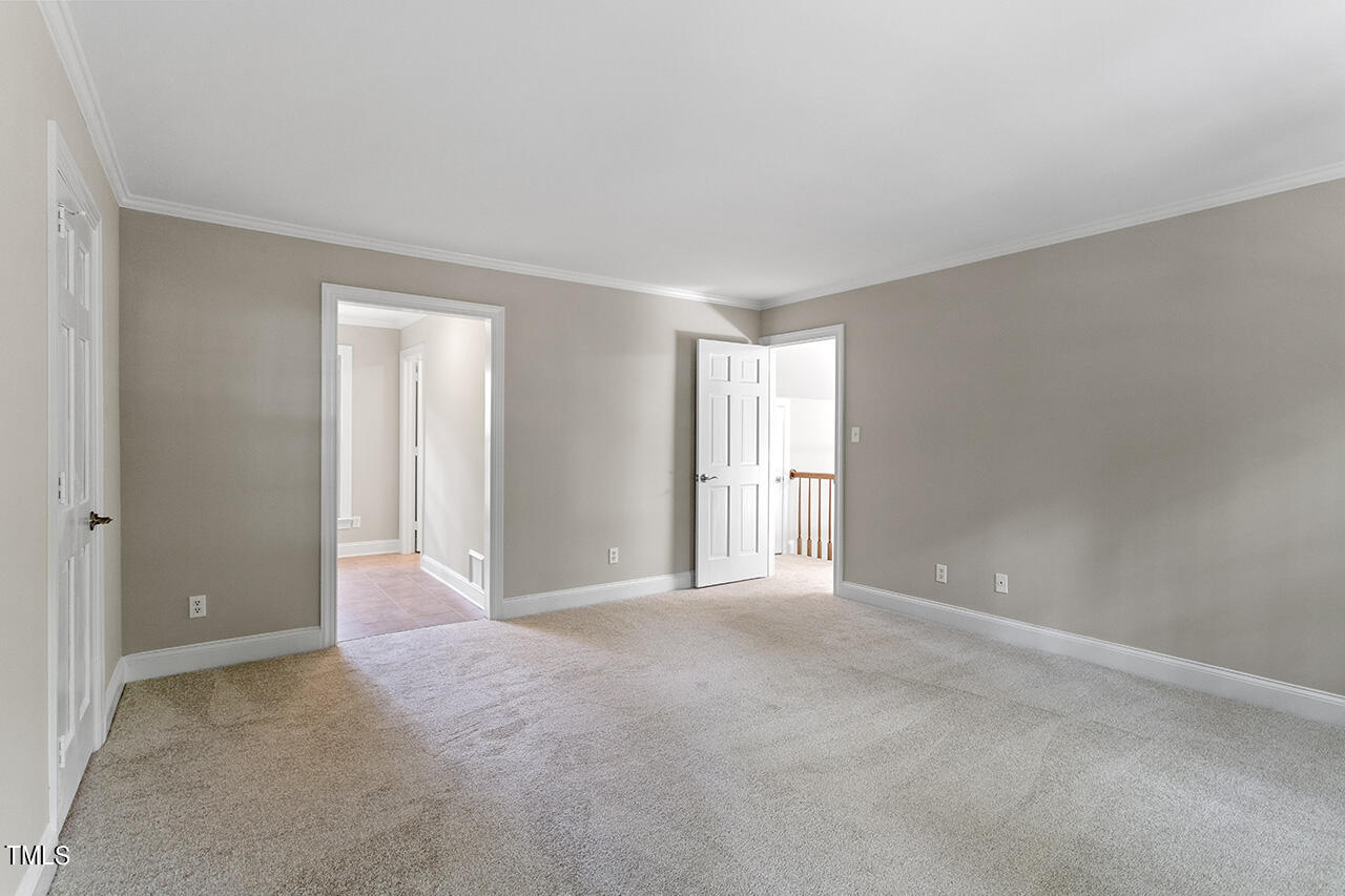 5200 Smallwood Court Raleigh, NC 27613 - Photo 17 of 38 a view of an empty room and window