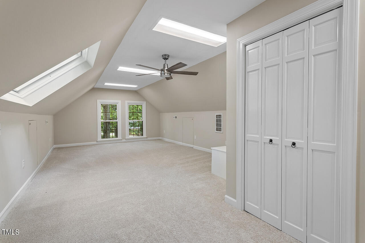 5200 Smallwood Court Raleigh, NC 27613 - Photo 27 of 38 a view of a livingroom with a ceiling fan and window