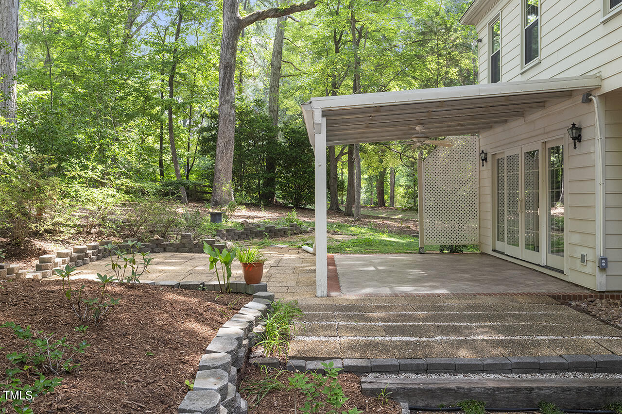 5200 Smallwood Court Raleigh, NC 27613 - Photo 29 of 38 a view of a house with backyard and sitting area