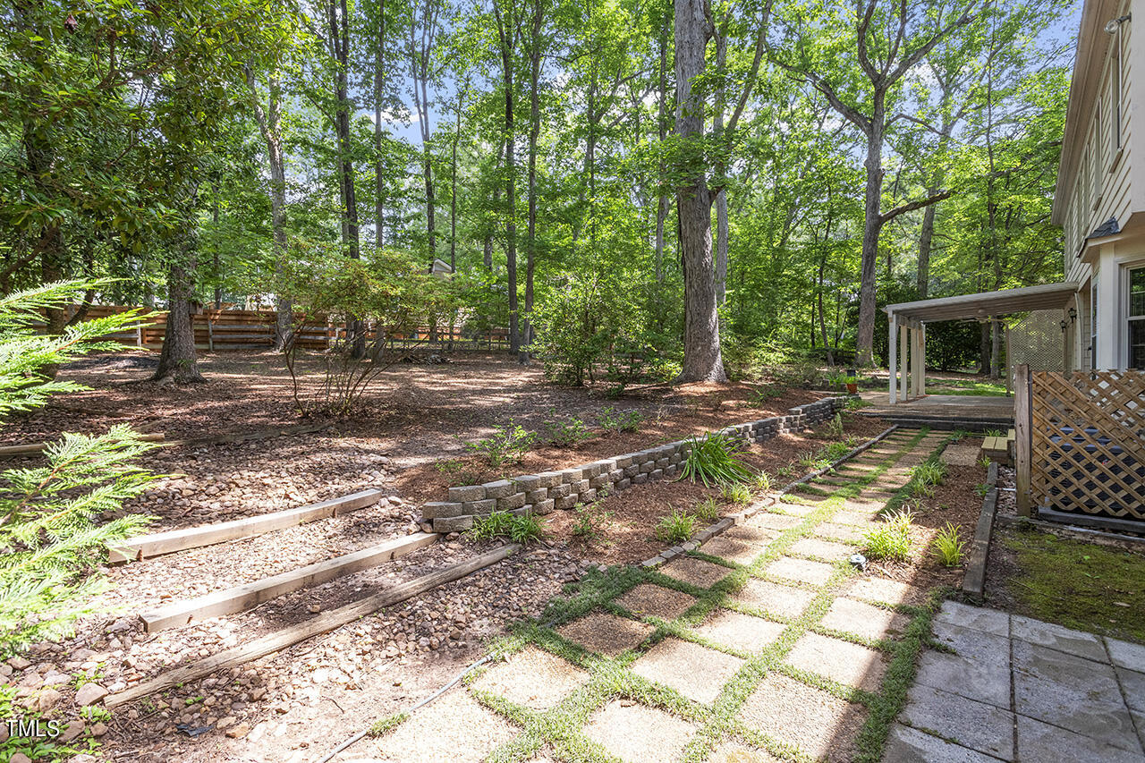 5200 Smallwood Court Raleigh, NC 27613 - Photo 31 of 38 a view of backyard of house with seating space