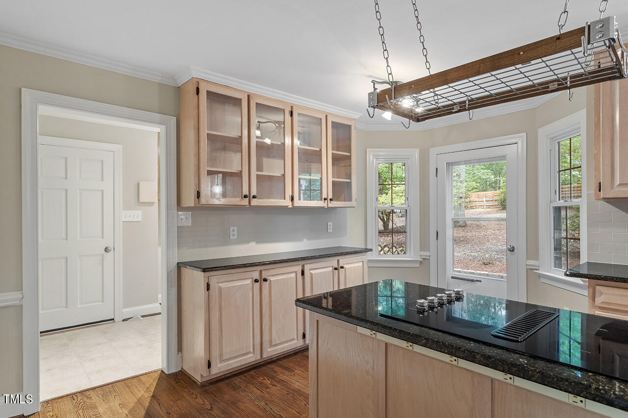 5200 Smallwood Court Raleigh, NC 27613 - Photo 10 of 38 a kitchen that has a lot of cabinets in it