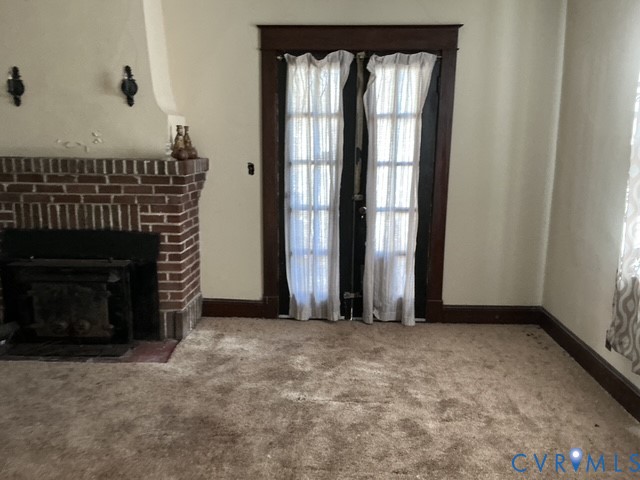 1633 Stuart Avenue Petersburg, VA 23803 - Photo 9 of 28 Unfurnished living room featuring carpet and a fir