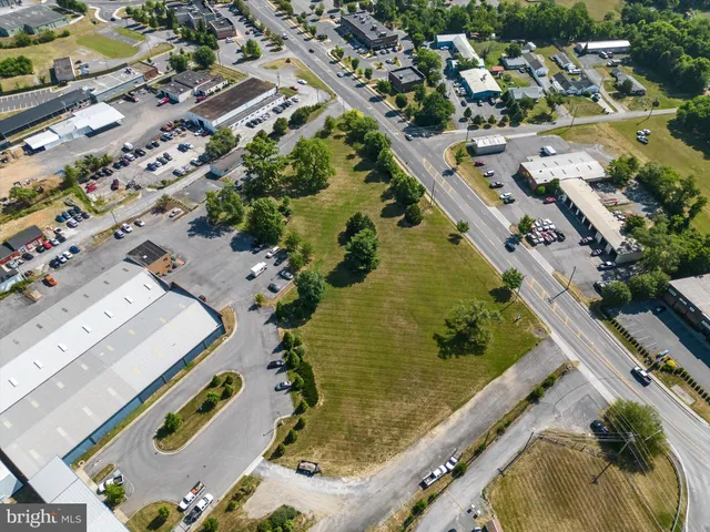 an aerial view of a residential houses with outdoor space