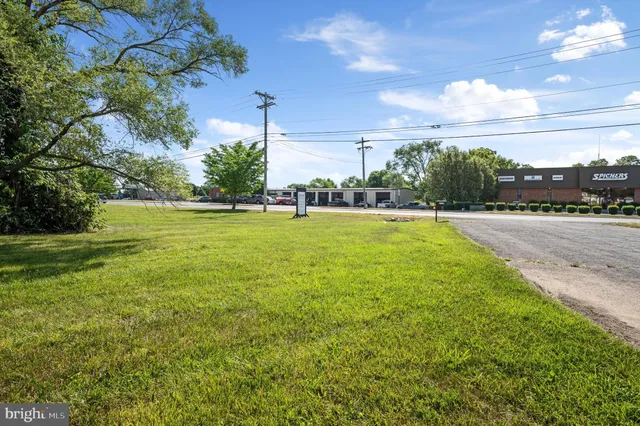 a view of a swimming pool and a yard
