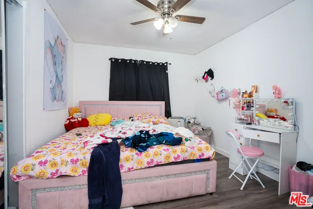 a bedroom with a bed and a table in it