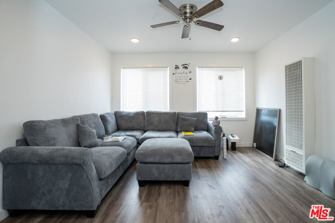1047 East 33rd Street Los Angeles, CA 90011 - Photo 17 of 24 a living room with furniture and a wooden floor