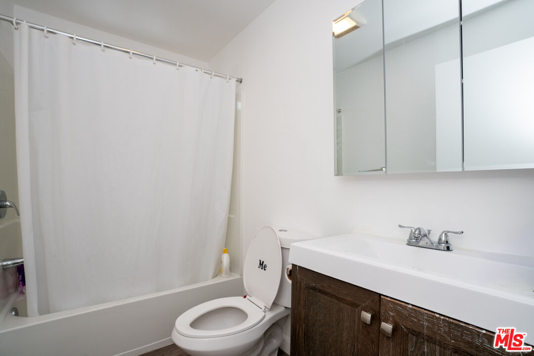 1047 East 33rd Street Los Angeles, CA 90011 - Photo 20 of 24 a bathroom with a sink a toilet and shower