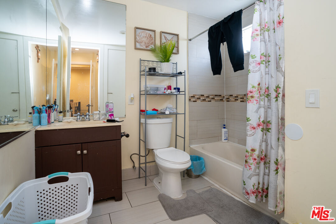 1047 East 33rd Street Los Angeles, CA 90011 - Photo 24 of 24 a bathroom with a sink toilet and shower