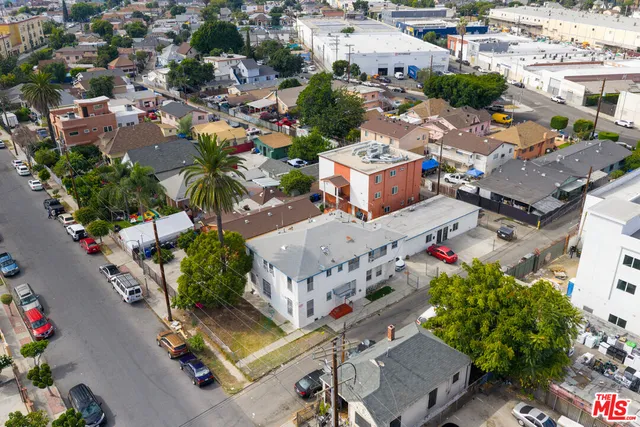 an aerial view of a houses with yard