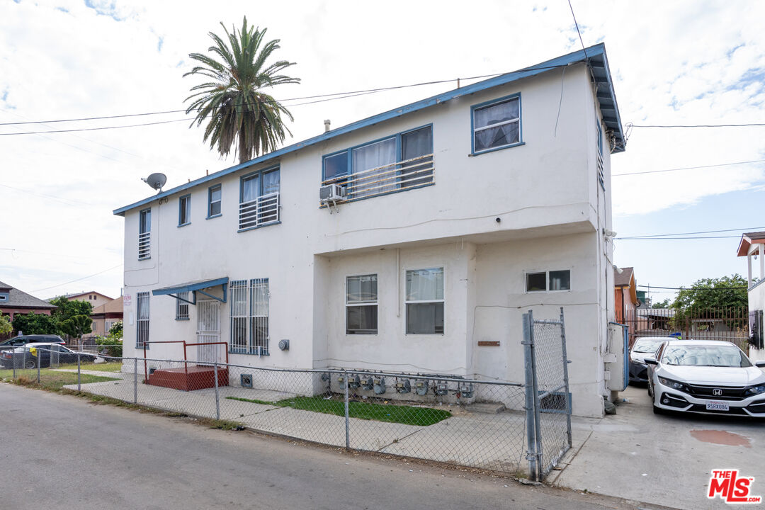 1047 East 33rd Street Los Angeles, CA 90011 - Photo 9 of 24 a view of a car park in front of house