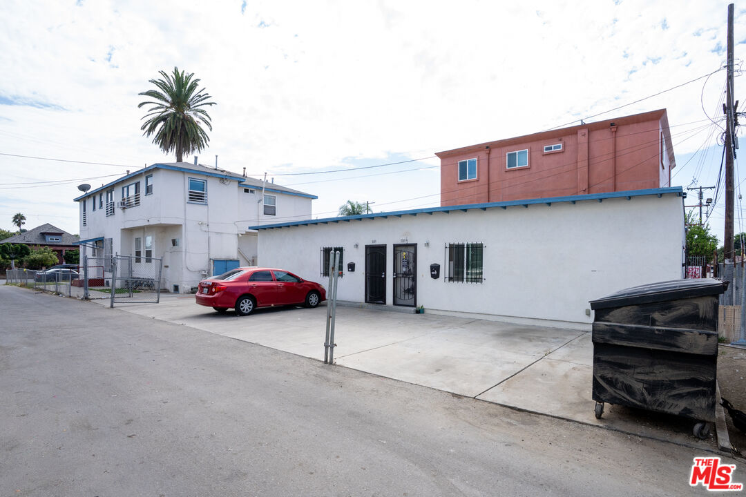 1047 East 33rd Street Los Angeles, CA 90011 - Photo 10 of 24 a car parked in front of a house