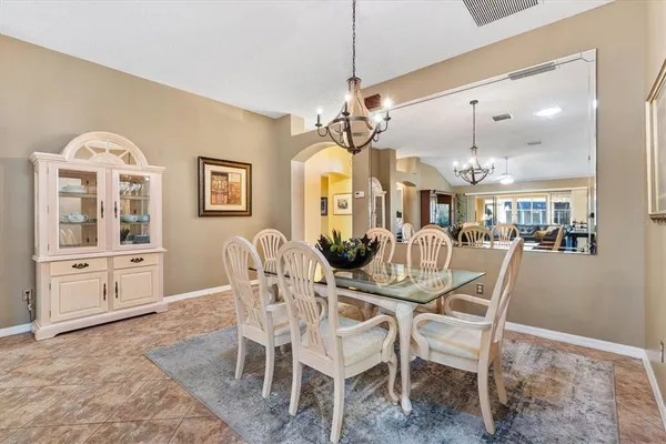 a kitchen with sink cabinets and dining table view