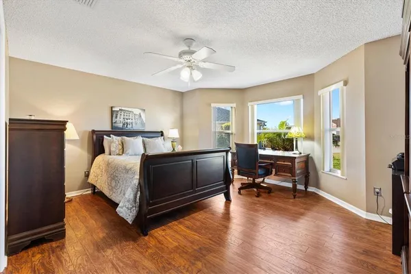 a bedroom with a bed and dresser