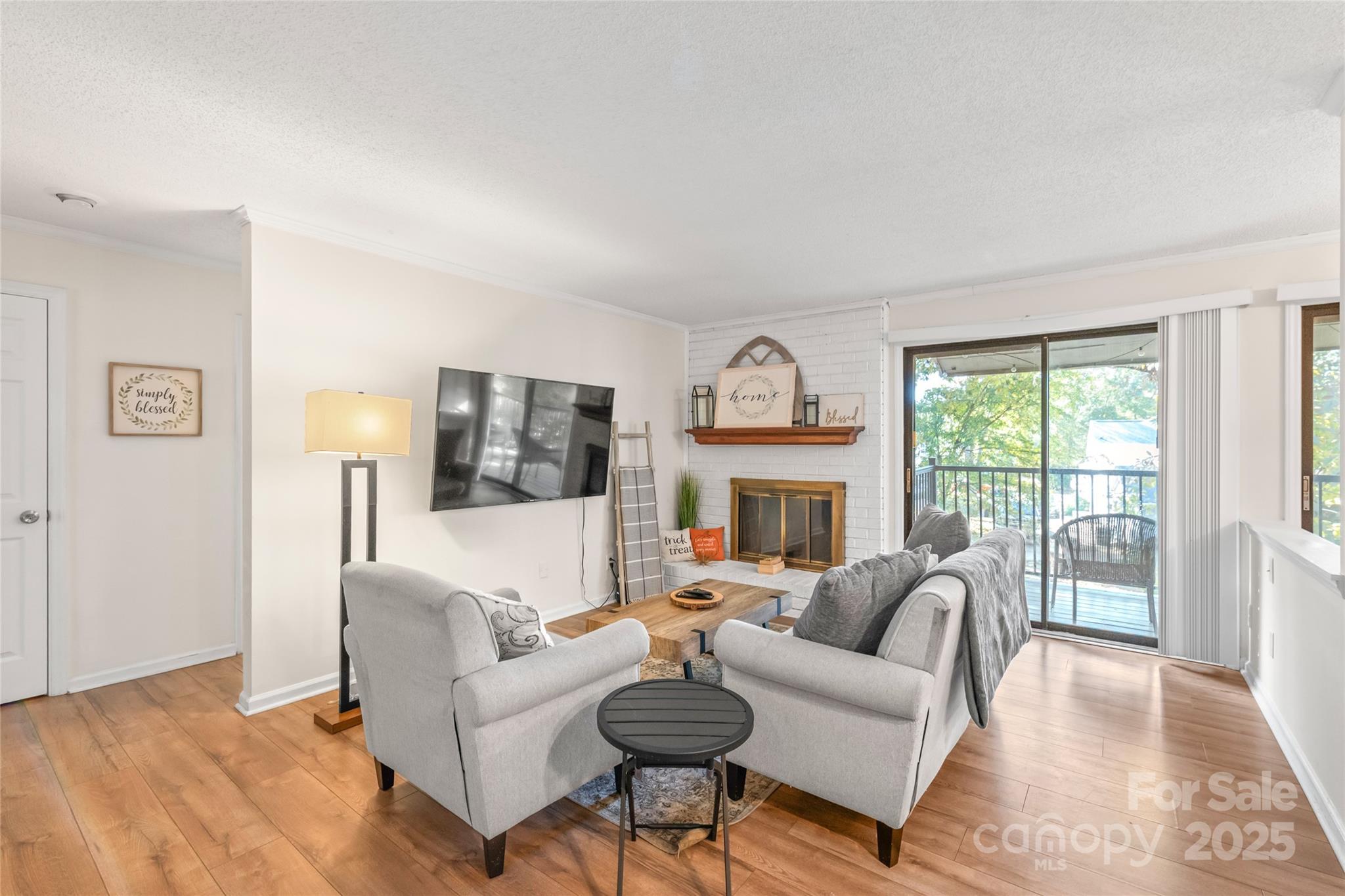 11058 Cedar View Rd. Charlotte, NC 28226 - Photo 1 of 28 a living room with fireplace furniture and a large window
