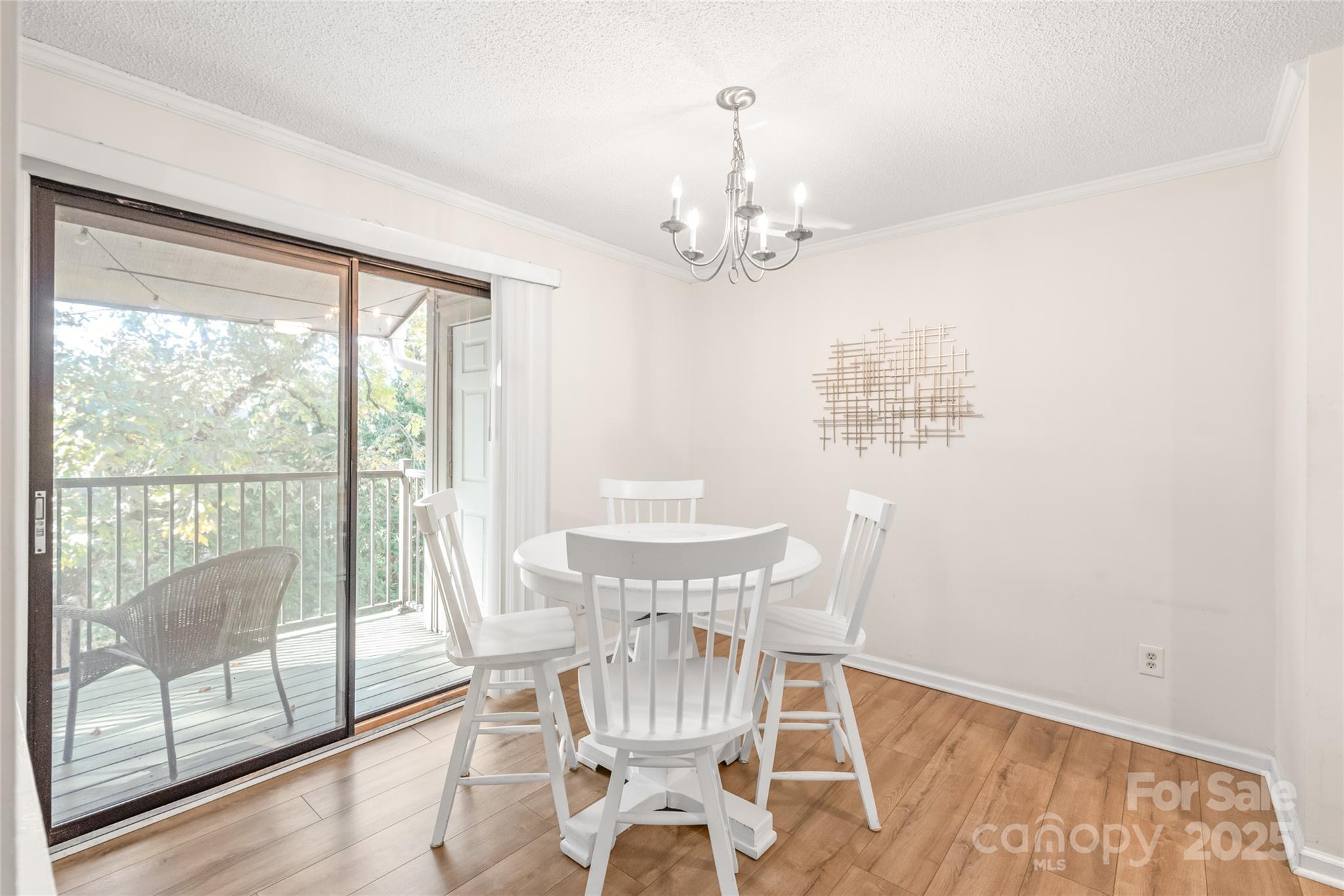 11058 Cedar View Rd. Charlotte, NC 28226 - Photo 12 of 28 a view of a dining room with furniture wooden floor and a chandelier