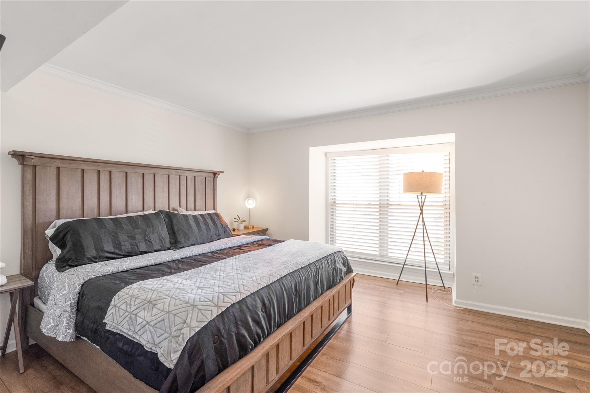 11058 Cedar View Rd. Charlotte, NC 28226 - Photo 17 of 28 a bed sitting in a bedroom next to a window