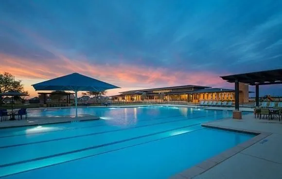 a view of an ocean & house and a yard