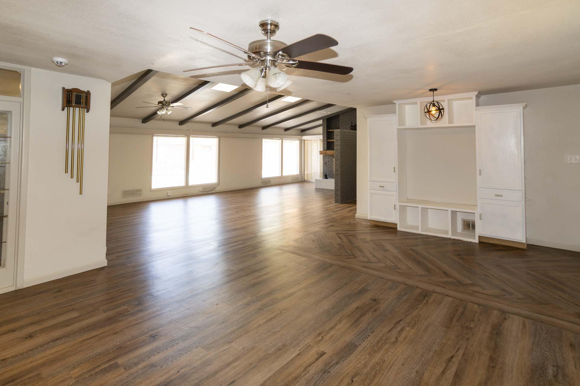 2136 57th Street Lubbock, TX 79412 - Photo 4 of 41 a view of a hallway with wooden floor