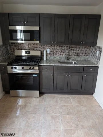 a kitchen with a stove and a microwave