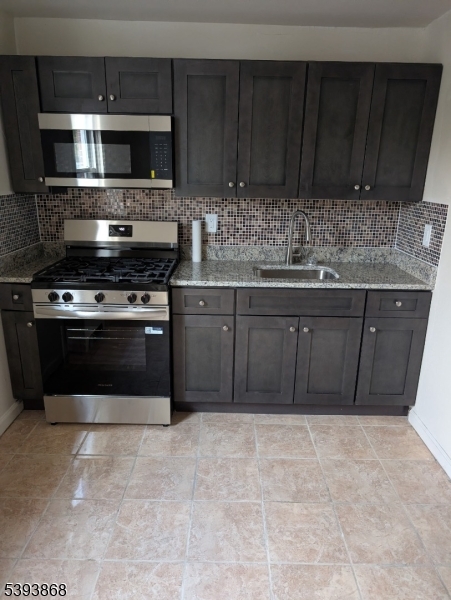 364 Orange Road, Unit B5 Montclair, NJ 07042 - Photo 4 of 5 a kitchen with a stove and a microwave