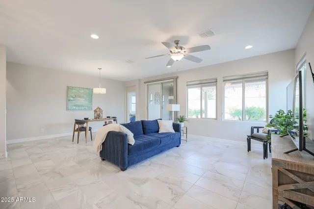 a dining room with furniture and window