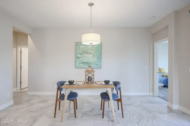 a bedroom with a bed and a chair