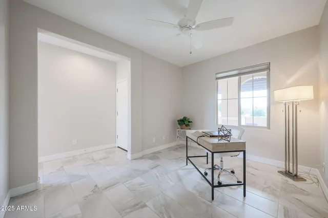 a en suite bathroom with double sink and a mirror
