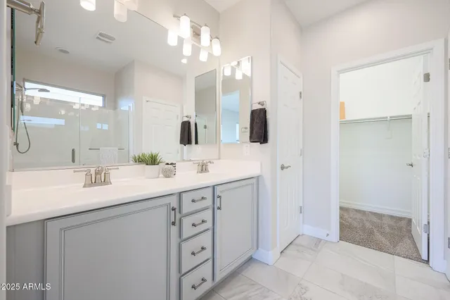 a bedroom with bed and a window