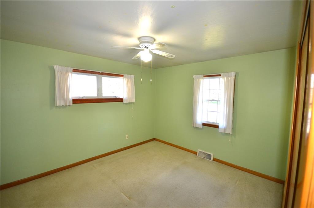 123 Jackson Street Harmony, PA 16037 - Photo 9 of 10 an empty room with windows and fan